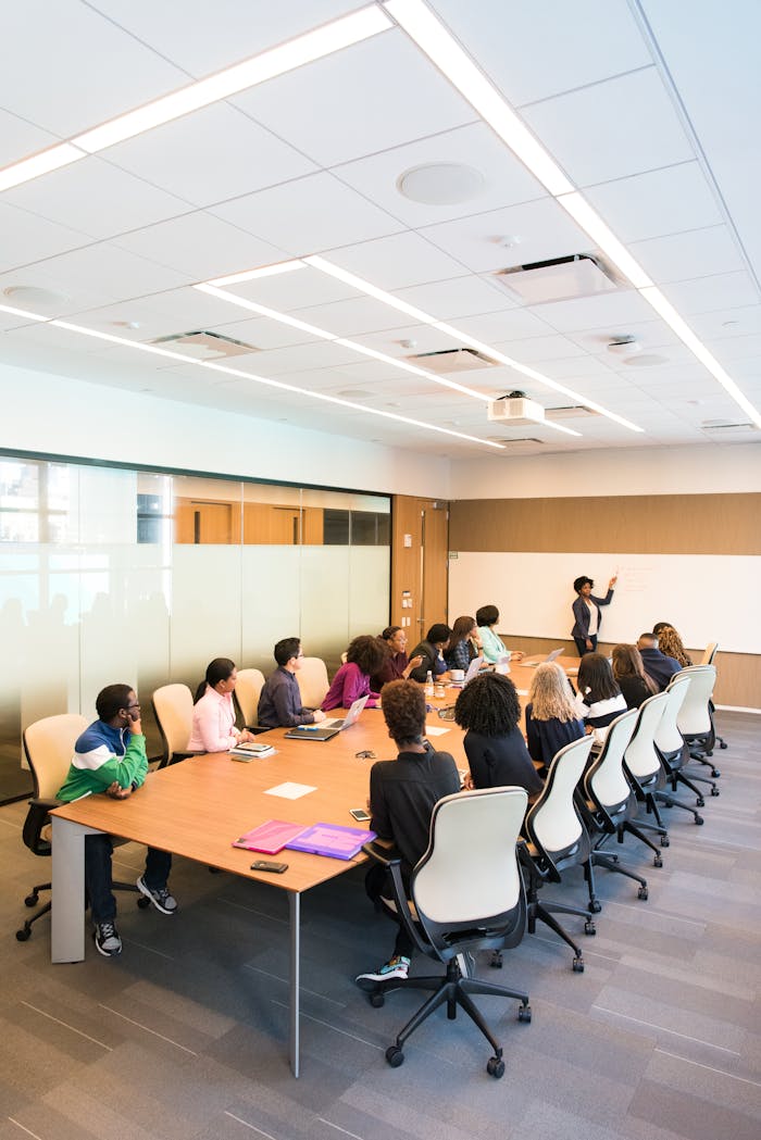 The Art of Drawing Readers In: Your attractive post title goes here Professional team engaged in a collaborative boardroom meeting with a presentation in progress.